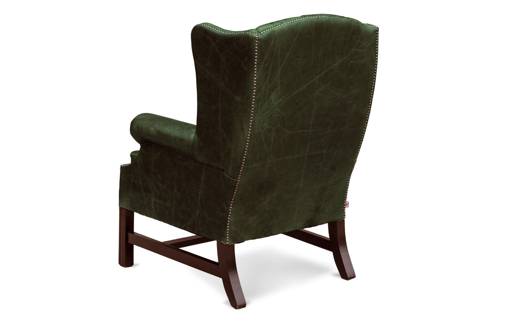Dark green wingback store chair